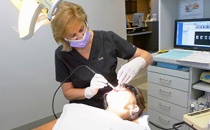 Dental hygienist cleaning patient teeth at CityView Family Dentistry Skokie